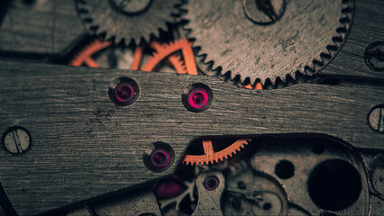 Details of an old mechanical watch close-up. Selective focus on details. Grunge background of vintage clock elements