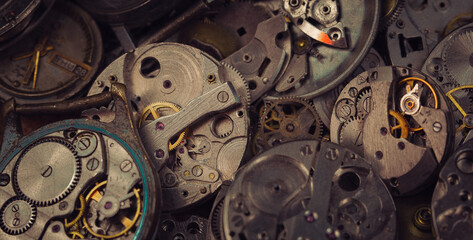 Details of an old mechanical watch close-up. Selective focus on details. Grunge background of vintage clock elements
