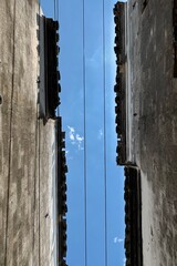 sky cropped by ancient wall and wire