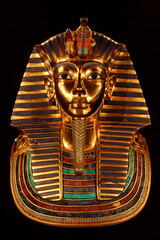 Funerary burial mask of egyptian pharaoh Tutankhamun. Isolated on black background.