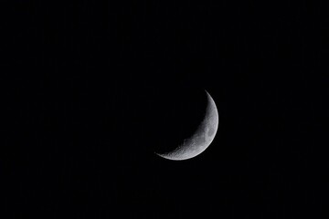 Obraz na płótnie Canvas Moon over dark black sky at night