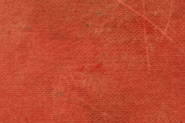 Fototapeta premium The texture of the old book cover is orange. Grunge background, worn vintage surface