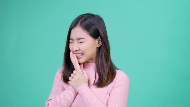 Beautiful smiling of young asian woman with retainer braces with white teeth hurt teeth emotion