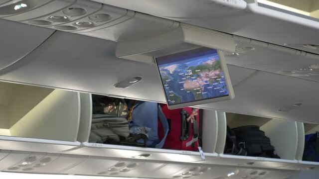 LCD monitor showing a map in the airplane in 4K slow motion 60fps