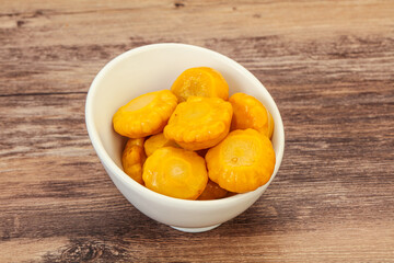 Marinated yellow patisson in the bowl