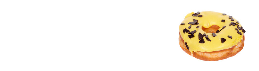 Sweet donut with icing and chocolate drops, isolated on white background.