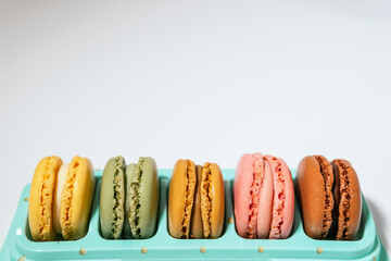 Colorful macarons on a white background. Macarons concept. Sweet desert.
