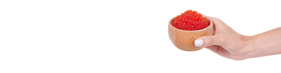 Hand with luxury red caviar in wooden jar, expensive healthy seafood, isolated on white background.
