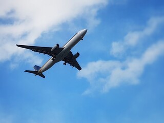 Fototapeta na wymiar Low Angle View Of Airplane Flying Against Sky