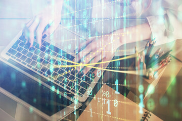 Double exposure of woman hands working on computer and data theme hologram drawing. Tech concept.