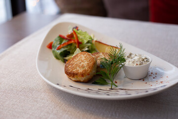 Fish cutlet with salad