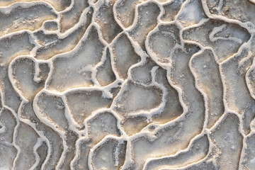 An abstract white and grey background formed by geothermal waters.