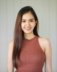 Portrait of cute beautiful Asian woman with long hair smile and posing to camera with friendly and self confident.