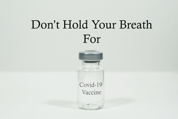 Don't Hold Your Breath for Covid-19 Vaccine Wording and A Vial Isolated With White Background