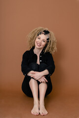 blonde with afro curls at a photo shoot