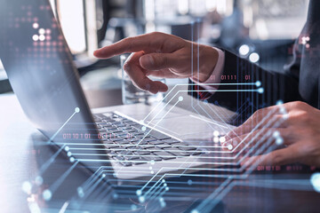 Hands typing the keyboard to create innovative software to change the world and provide a...