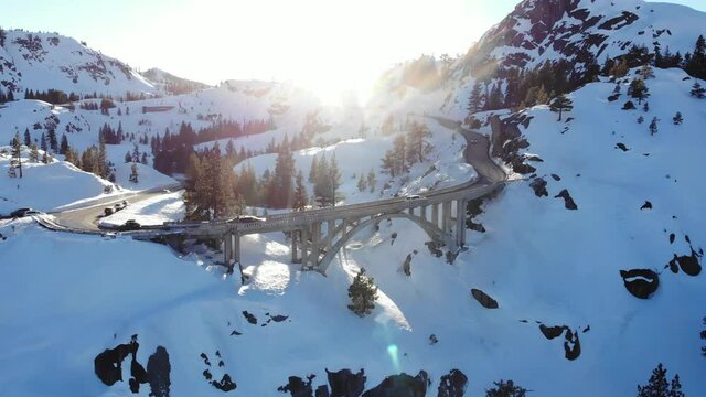 Tilt Up on Snowy Winter Bridge Near Donner Summit and Truckee California - Drone
