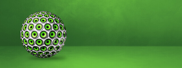 Speakers sphere on a green studio banner
