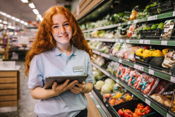 Young worker working in a supermarket