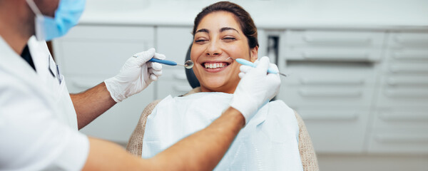 Woman visiting dentist at clinic