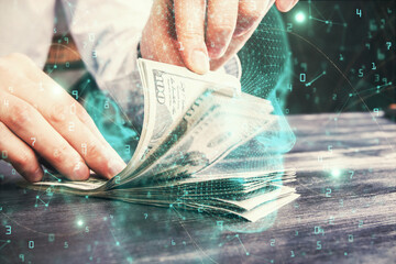 Multi exposure of brain drawing hologram and us dollars bills and man hands. Ai invest concept