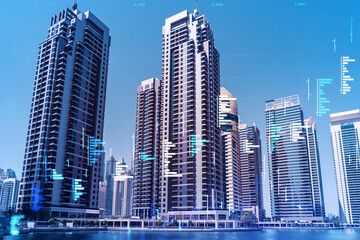 Obraz premium Skyscrapers of Dubai business downtown. International hub of trading and financial services of Western Asia. FOREX graph and chart concept. Double exposure. Dubai Canal waterfront.