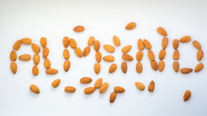 word almonds made of almonds on white background