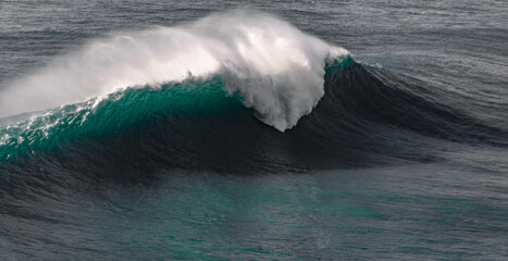 big wave breaking at Praia do Norte, Nazare