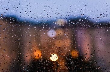 watching a rainy day in front of the window
