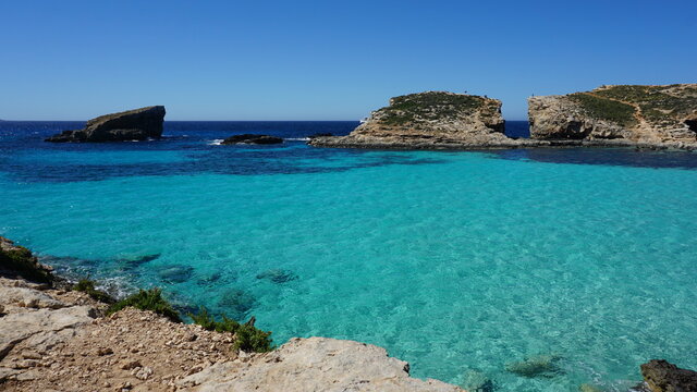 the view of Cominotto Island from the Blue Lagoon on Comino Island, Malta, March