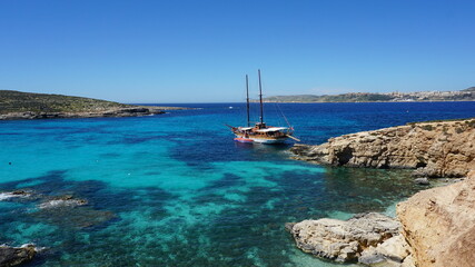 the view of Cominotto Island from the Blue Lagoon on Comino Island, Malta, March