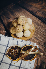 coconut candies photographed with kitchen decoration on a wooden background