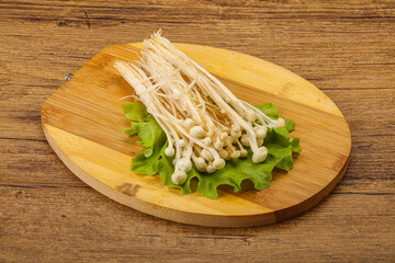 Raw Enoki mushrooms for cooking