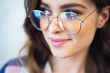 Beautiful young female student in eyeglasses 