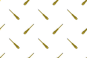 Screwdrivers seamless pattern. Metal screwdrivers with a striped rubberized handle. Background on the theme of tools, service, repair. 