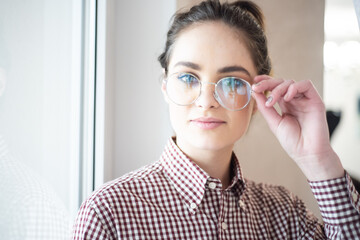 Beautiful young female student in eyeglasses 