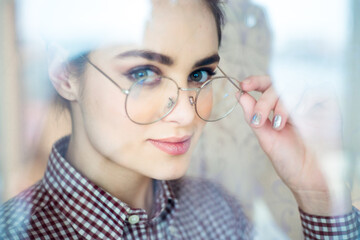 Beautiful young female student in eyeglasses 
