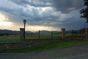 beautiful sunset in a rural house with mountains behind, in the Aragonese Pyrenees, located in Gerbe, Huesca, Spain.