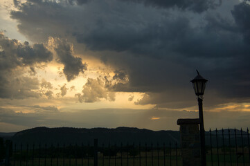 beautiful sunset in a rural house with mountains behind, in the Aragonese Pyrenees, located in...