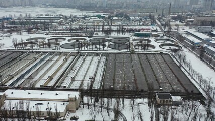 Europe, Kiev, Ukraine - February 2021: Bortnytsia aeration station, Bortnychi. Aerial drone view. Sewage treatment plant. Wastewater treatment plant. Kyiv Bortnychi aeration station.