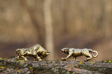 Metal figurine of a bull and the tiger.