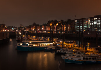 Fototapeta na wymiar long exposure Hamburg river ships and buildings at night