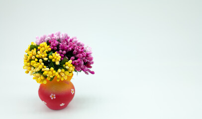 Beautiful bouquet of decorative flowers in a vase. Spring background with space for text.