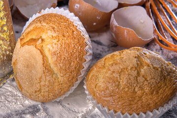 Elaboration of homemade pastries, traditional baked muffins with eggs, milk, extra virgin olive oil and flour, healthy and wholesome cooking.