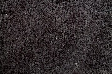 black knitted textile fabric made of wool