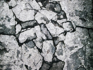 Chaotic masonry. Hard surface structure with cracks and bruises. Neutral gray structural background.