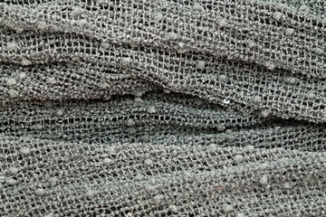 gray knitted nood with folds texture background