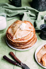 Thin pancakes with milk in a plate. crepes 