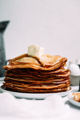 Thin pancakes with milk in a plate. crepes 
