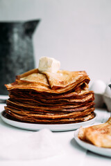 Thin pancakes with milk in a plate. crepes 